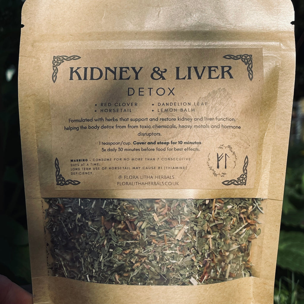 Herbal tea package labeled 'Kidney & Liver Detox' with visible herbs inside.