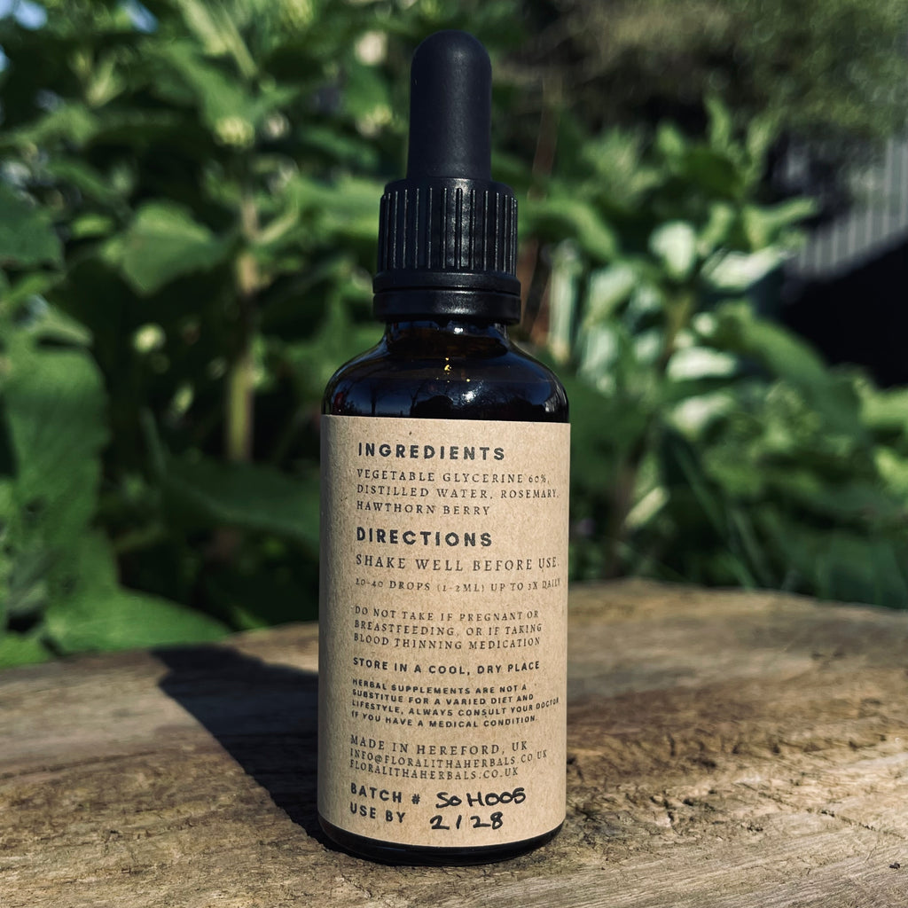 Bottle with dropper on a wooden surface with a natural background