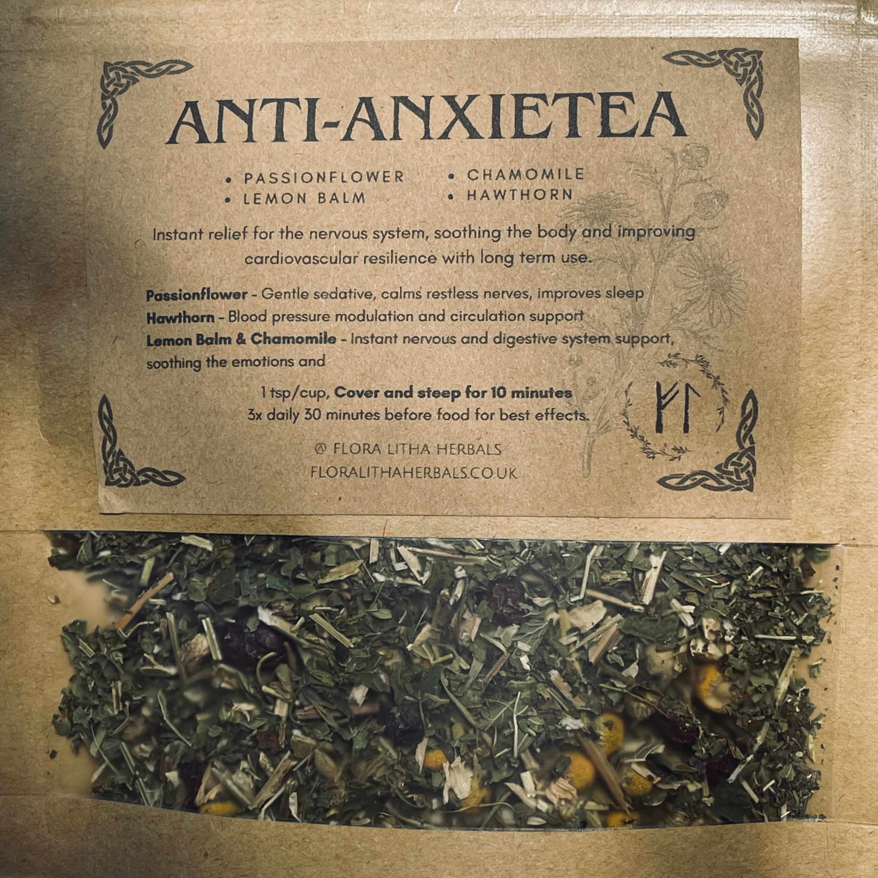 Herbal tea packaging with ingredients and benefits on a brown background